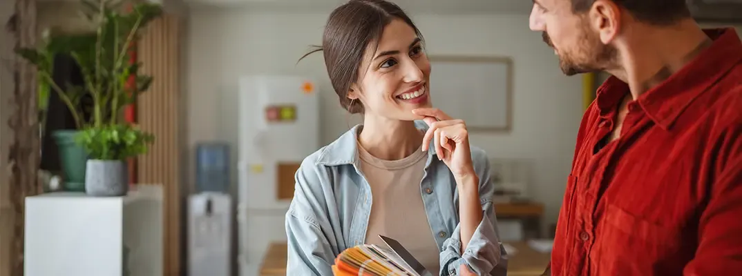 A woman thoughtfully listening to a person