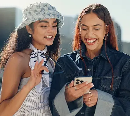 Two young women looking at a smartphone