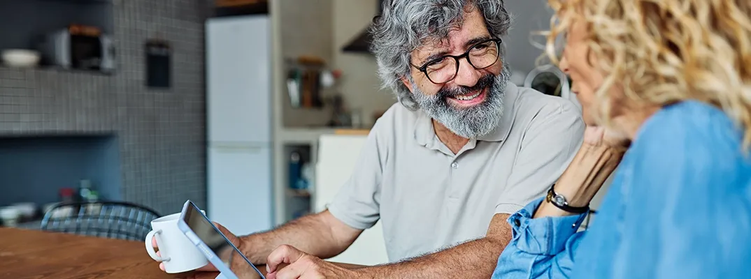A man with a beard doing a credit card payment