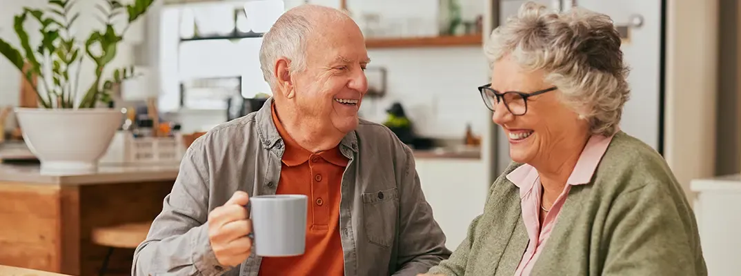 Elderly couple have coffee and smiling