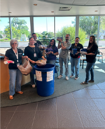 Sunward employees handling food donations.