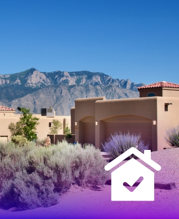 A house in front of mountain, with an icon of a house with checkmark inside of it