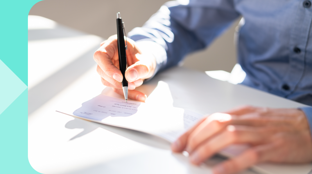 A hand writing with a pen.