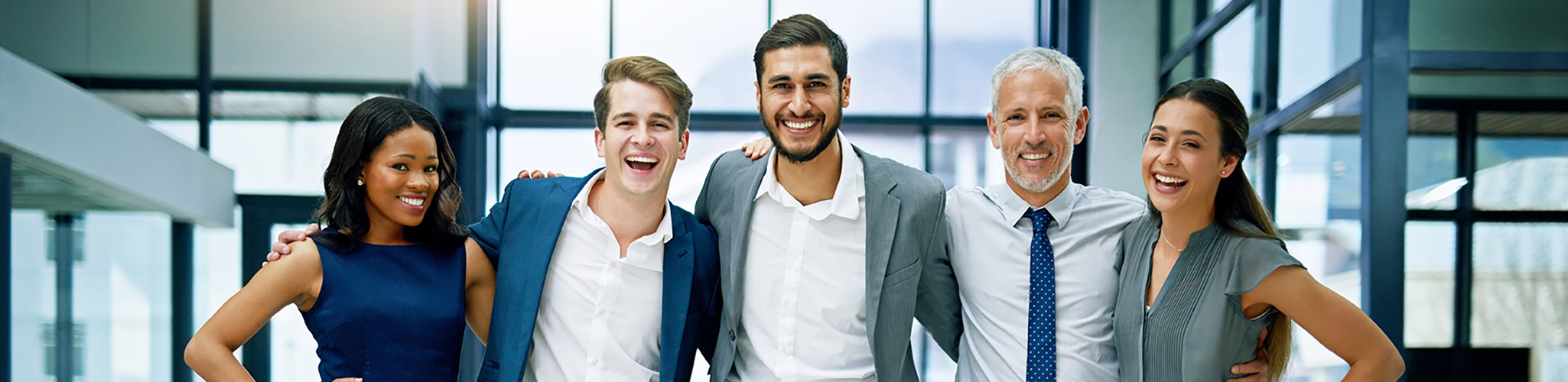 A group of five people standing side-by-side