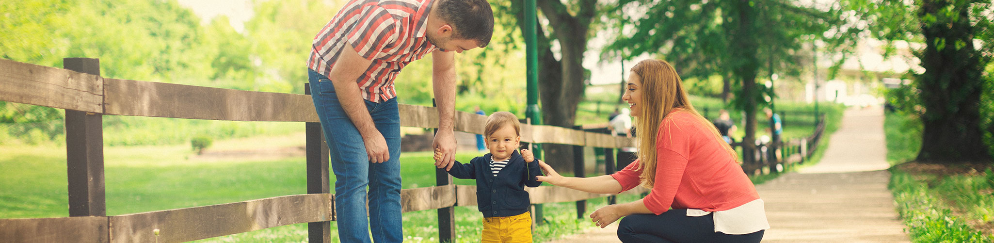 Parents talking a walk with their young son