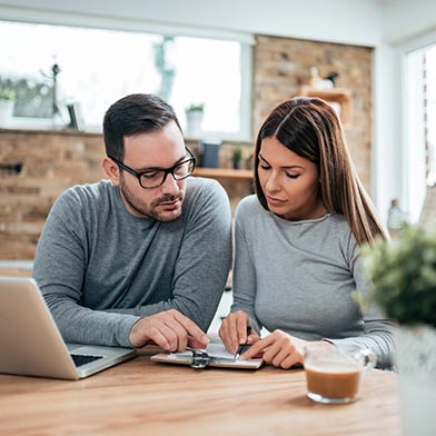 Man and woman looking over finances.