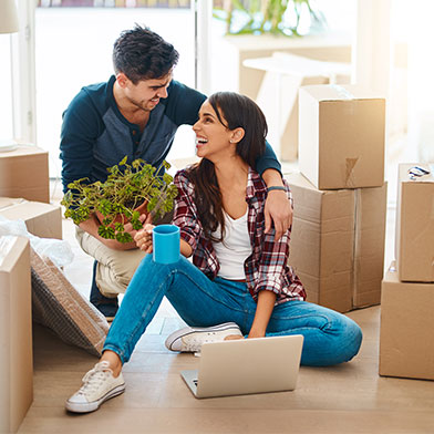 A young couple moving into a new home.