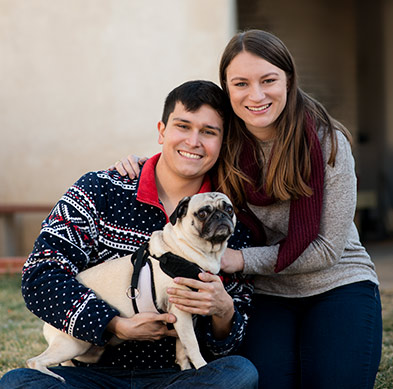 Pictured in the backyard of their new home are Sunward members Jacob Robinson-Brown and Kristina Jones, and their dog, Frank.