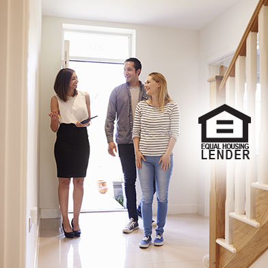 Couple viewing home with real estate agent