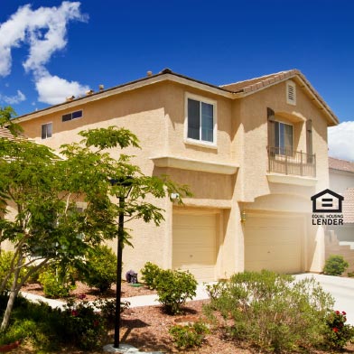 Exterior of Southwestern style suburban home with green tree outside