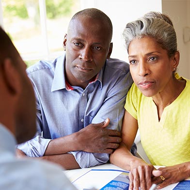 Older couple speaking with financial advisor