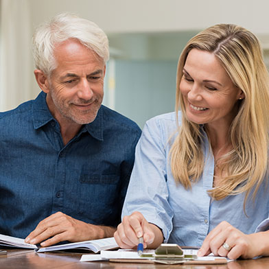 Older couple looking over paperwork