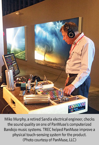 Mike Murphy, a retired Sandia electrical engineer, checks the sound quality on one of PanMuseâs computerized Bandojo music systems.