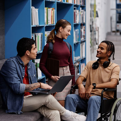 Three students hanging out in library