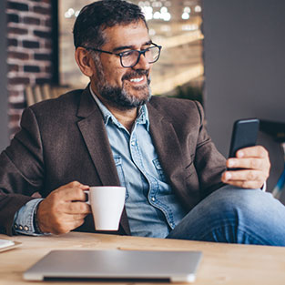 Business person looking at a smartphone.