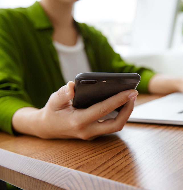 woman's hand holding a mobile phone