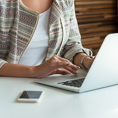 woman looking at a laptop