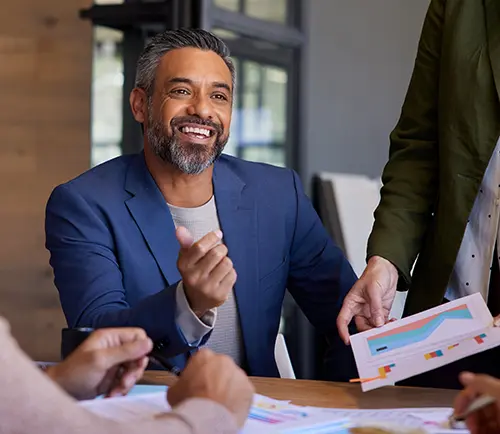 A well-dressed man in a business meeting